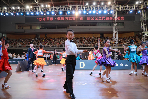 1532998977223082338.jpg Dancers prepare for the WDC China International Ballroom Dance Championships in Hohhot, Inner Mongolia autonomous region, July 28.jpg