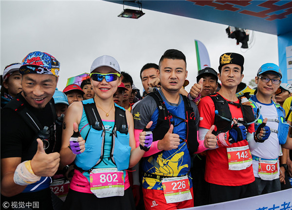 1534239820582067845.jpg Runners pose for photograph at the ultramarathon.jpg