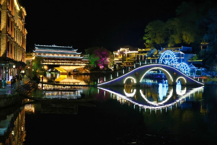 Enchanting night view of Fenghuang Ancient Town in autumn