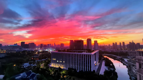 Morning glow paints Ningbo's sky