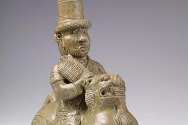 3rd-century celadon depicts a stylish Hu rider on a lion