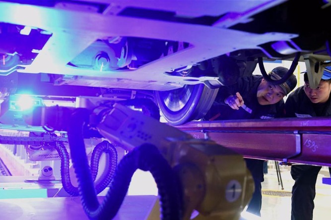 Robots employed in China's railway system during Spring Festival travel rush