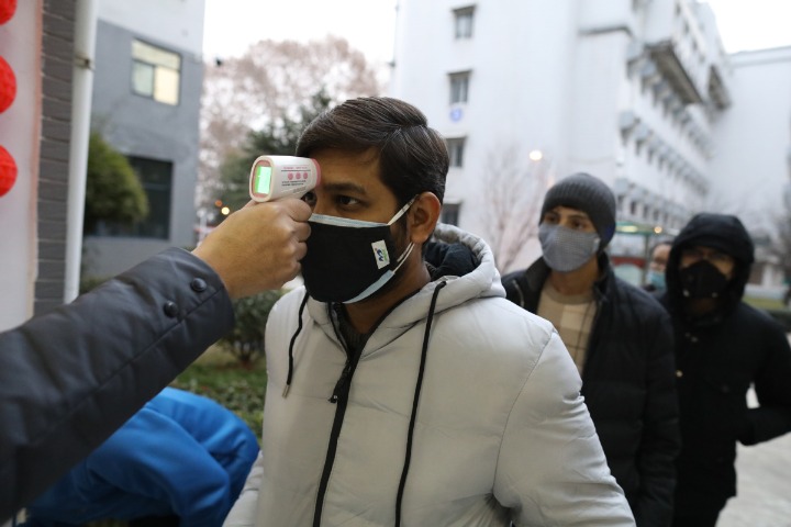 Foreign students praise support in hardest-hit city