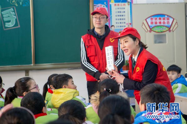 Woman volunteer lights up city with love