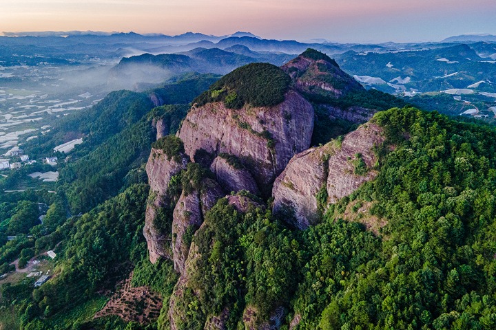 Jiangxi’s Danxia landform shrouded in morning mist