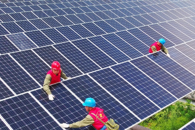 China builds vast solar, wind power parks in deserts