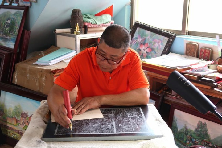 Artist produces traditional engravings on slate