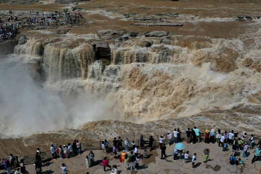 Hukou Waterfall transformed by heavy rains
