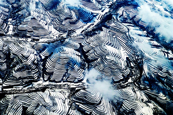 Snow-covered terraced fields in Zhuanglang county