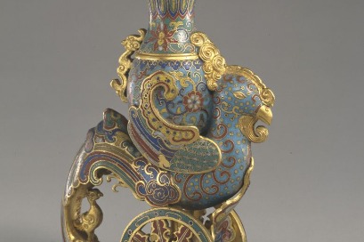 18th-century cloisonné artifact in the shape of a mythical chicken holding a zun vessel