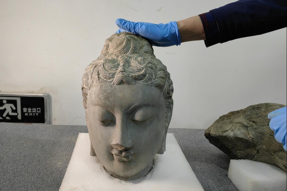 Ancient stone carvings unearthed in Longmen Grottoes caves