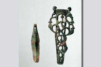 Ancient sword features bronze scabbard with openwork snake motifs