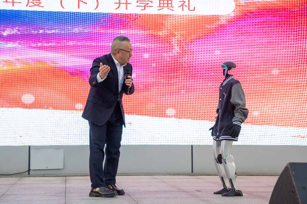 Humanoid robot, two robot dogs kick off start of semester