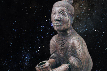 Snakes on ancient bronze figurine's chest