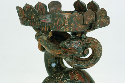 Black-lacquered wooden <em>dou</em> vessel with dragon-and-snake-shaped base