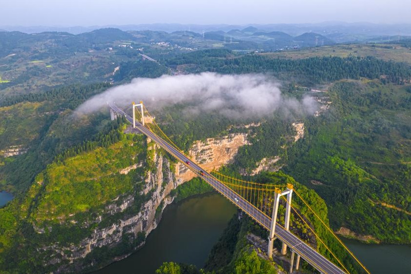 Highway soars above river and karst landscape in Guizhou