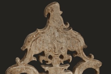 Neolithic jade pendant depicts eagle grasping human face