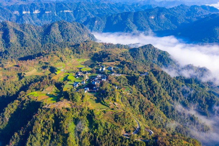 Early-winter sea of clouds paints a picturesque rural scene