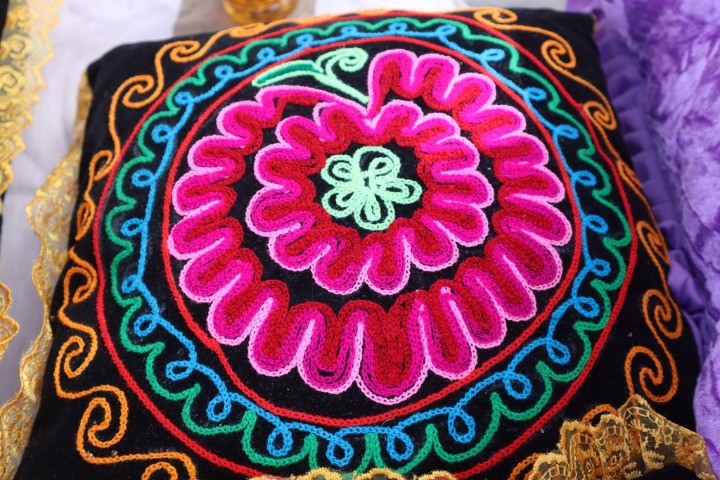 Folk art blooming at the needle's tip