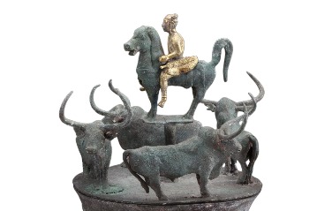 Horse on an ancient bronze cowrie receptacle