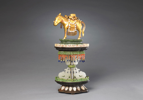 Gold horse serves as one of the sacred Buddhist offering treasures