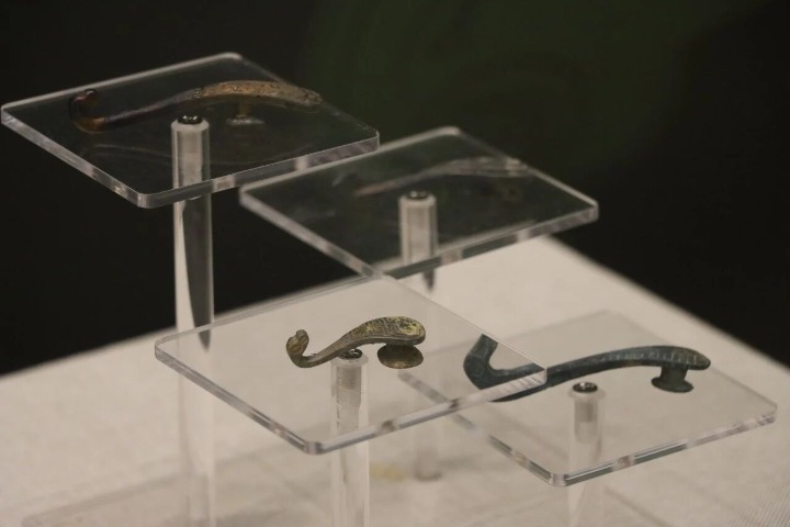 Bronze belt buckles from over 2,000 years ago on view in Hangzhou