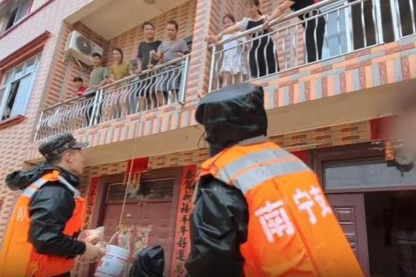 Military personnel join flood rescue after reservoirs overflow in Guangxi