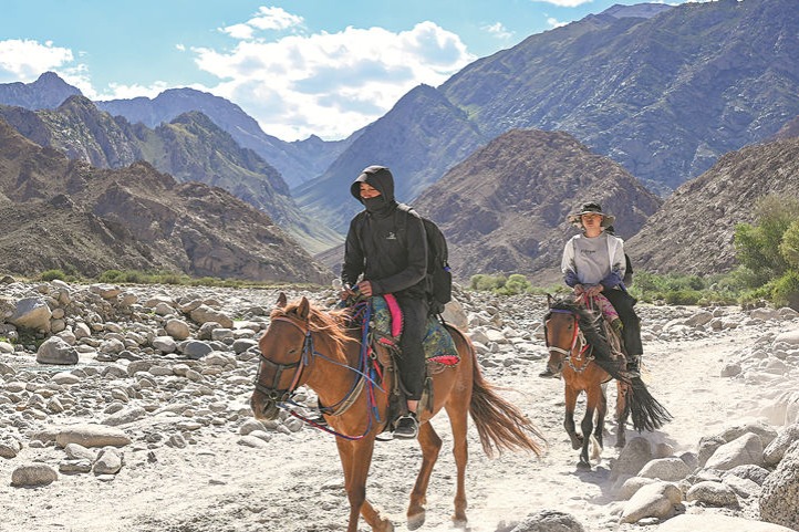 Horseback tours across Xinjiang's lush landscapes draw tourists